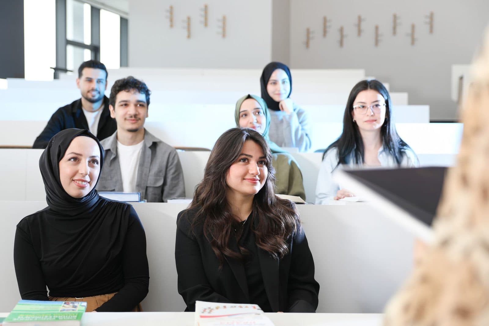 Learners listening in a lecture theatre